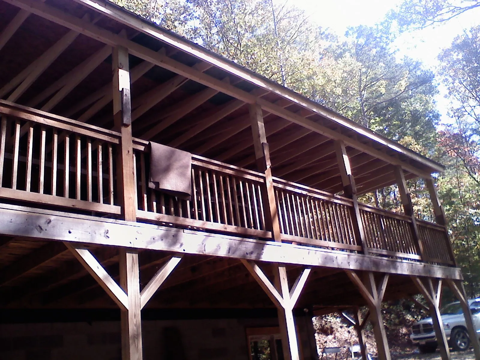 Timber framing under a new elevated porch and deck — Roof Leak Repair in Casco by Roofing Brothers